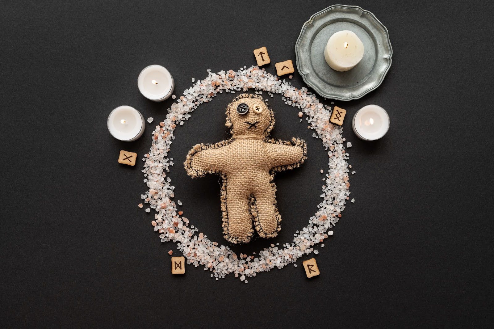 Butterfly or alchemy symbol representing transformation, shared resources and depth.